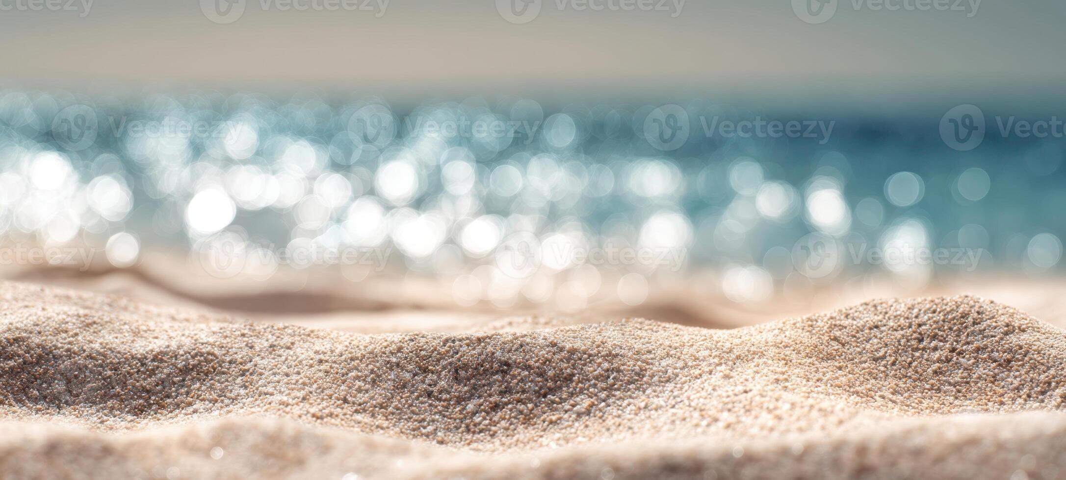 The tranquil beach with soft sand and sparkling ocean waves in background. photo