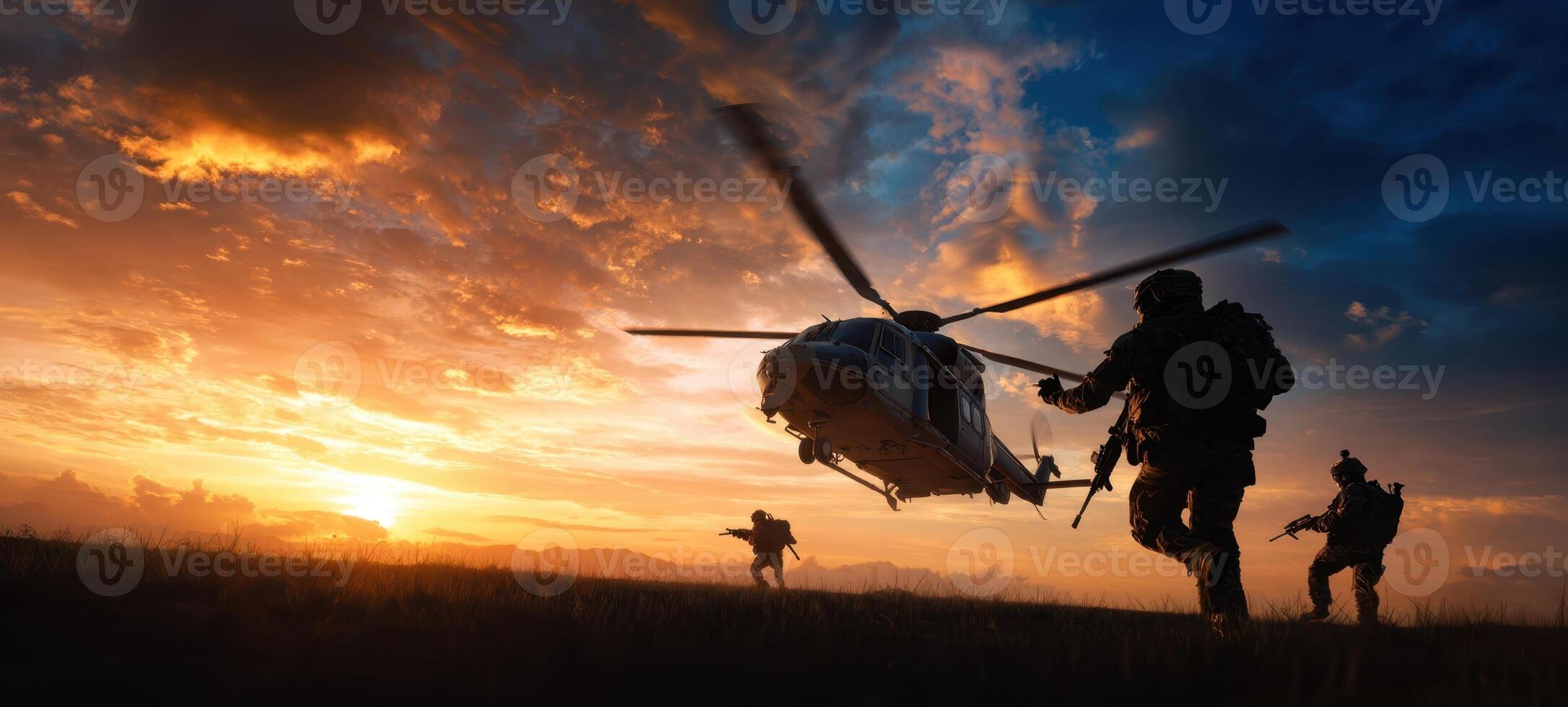 The helicopter hovering while illuminated soldiers prepare for an intense mission. photo