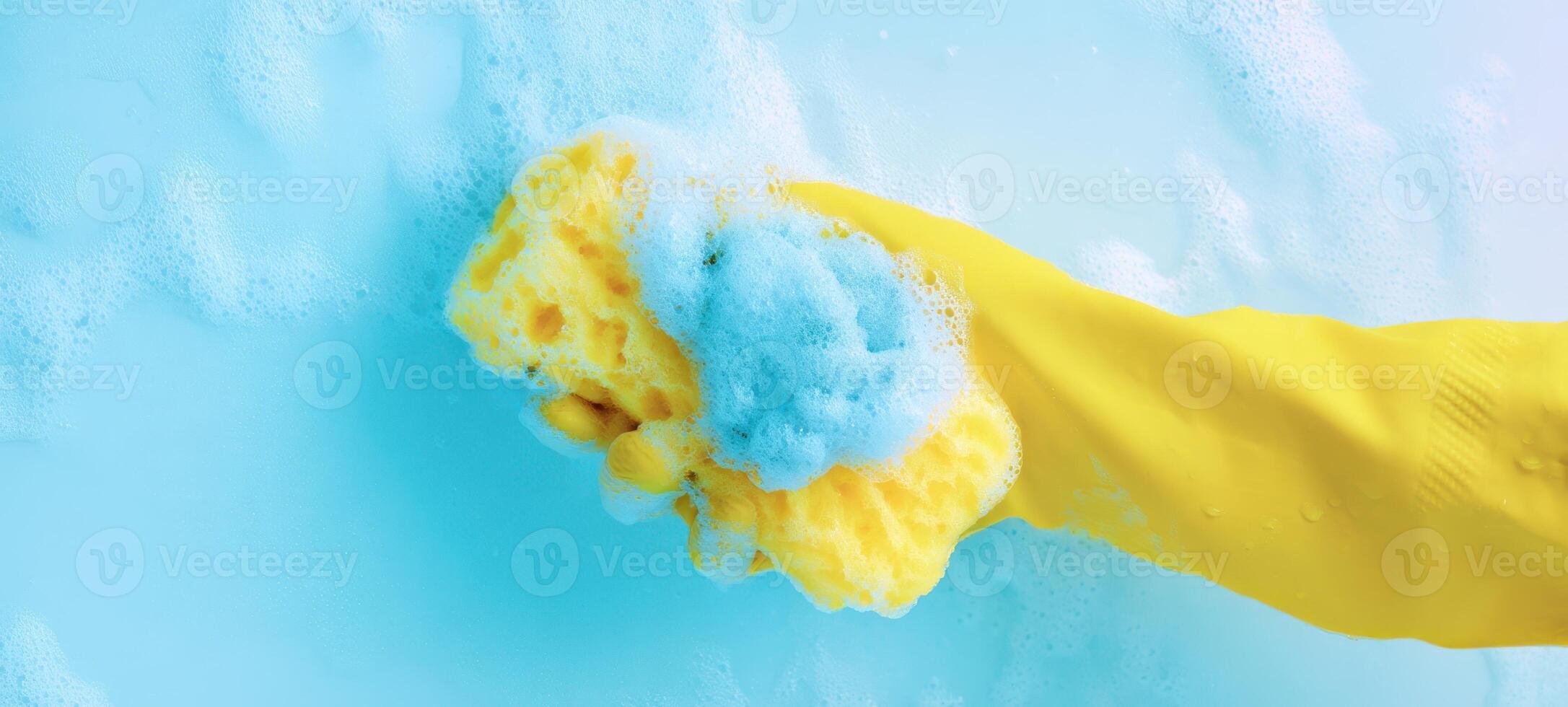 The yellow sponge gliding through bubbles in a sparkling clean environment. photo