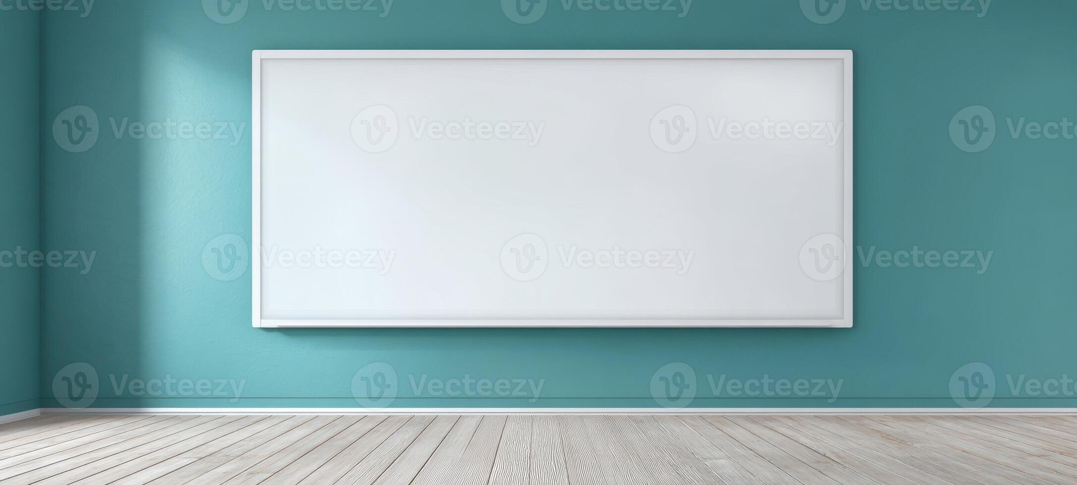 The empty classroom with a whiteboard set against a teal wall. photo