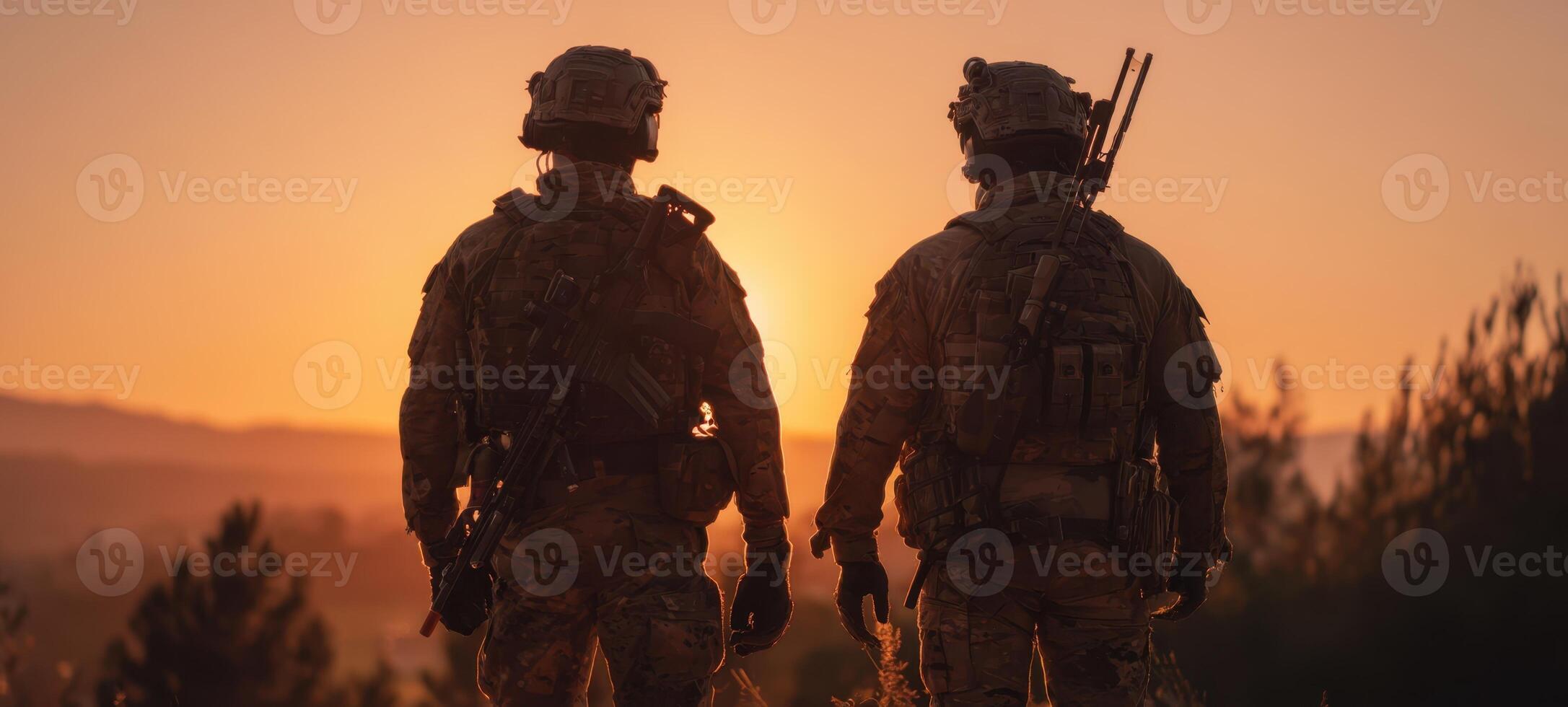 The soldiers standing together at sunset, ready for their next mission. photo