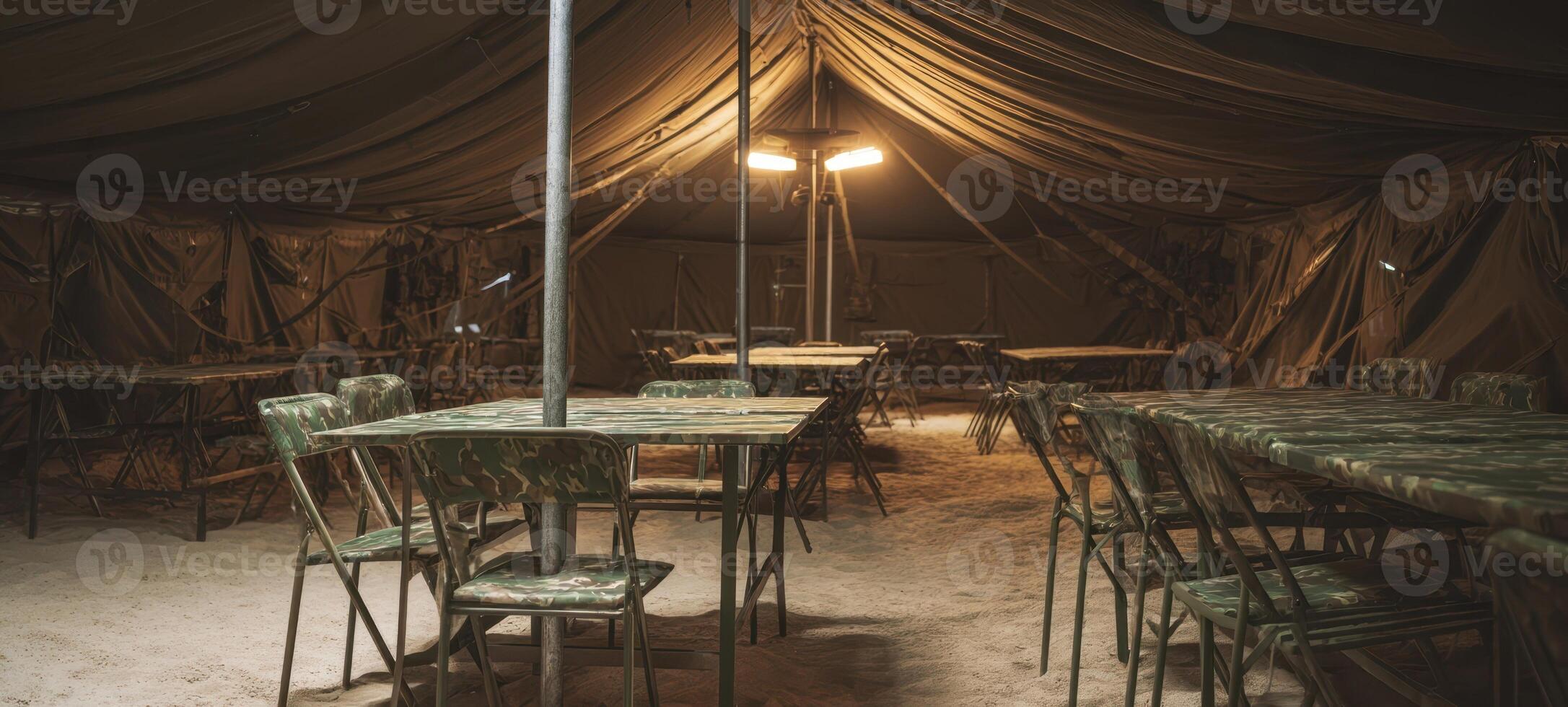The military dining tent with organized seating and ambient lighting features. photo