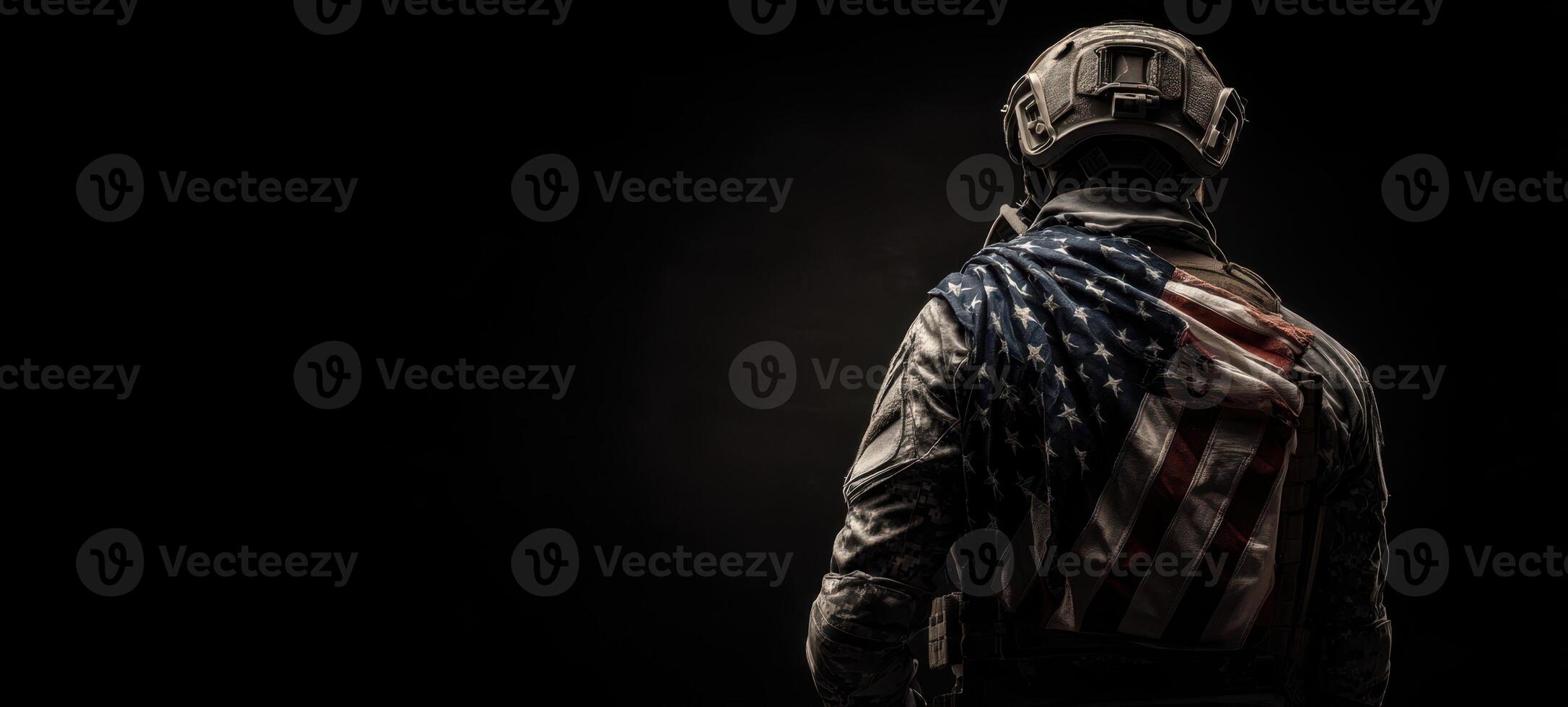 The Soldier Standing Proudly with the American Flag Draped Behind Him photo