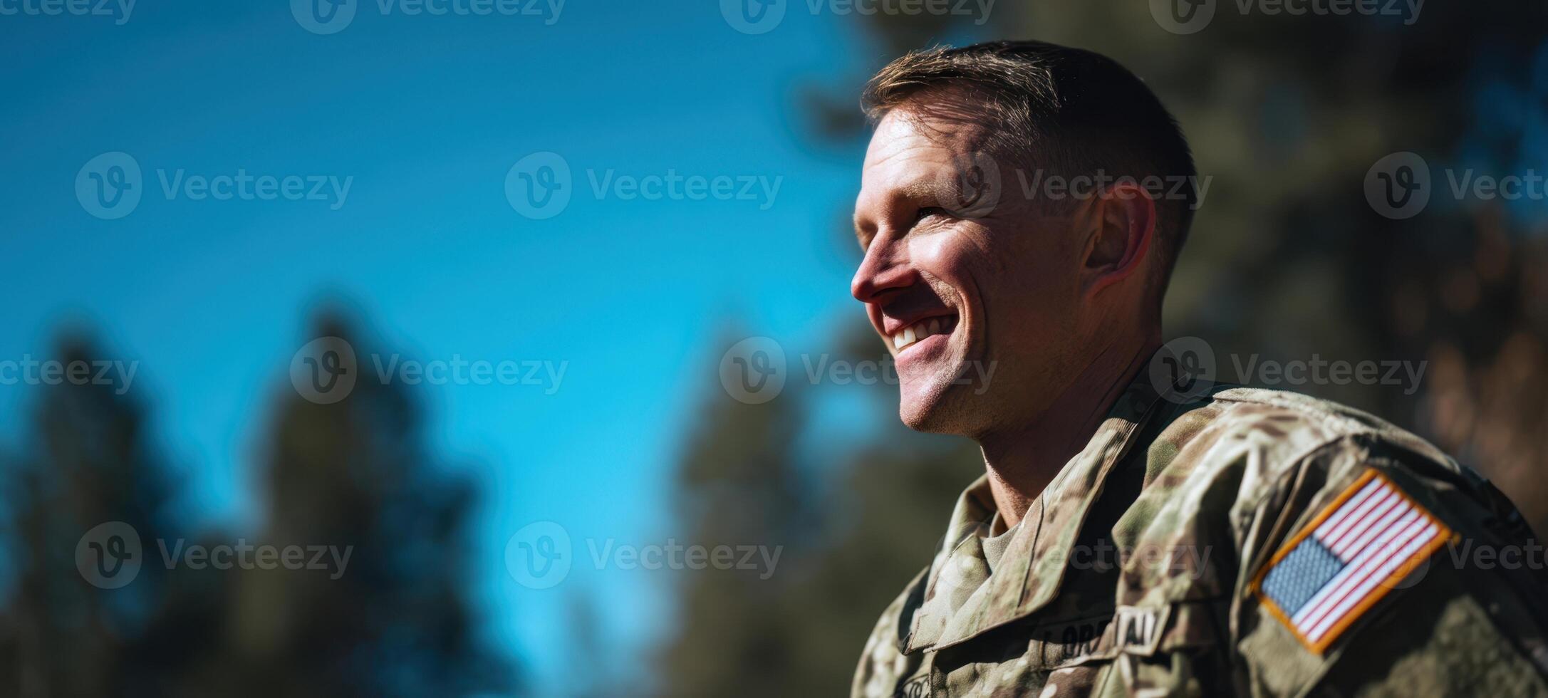 The smiling soldier showcasing pride and confidence in an outdoor setting. photo
