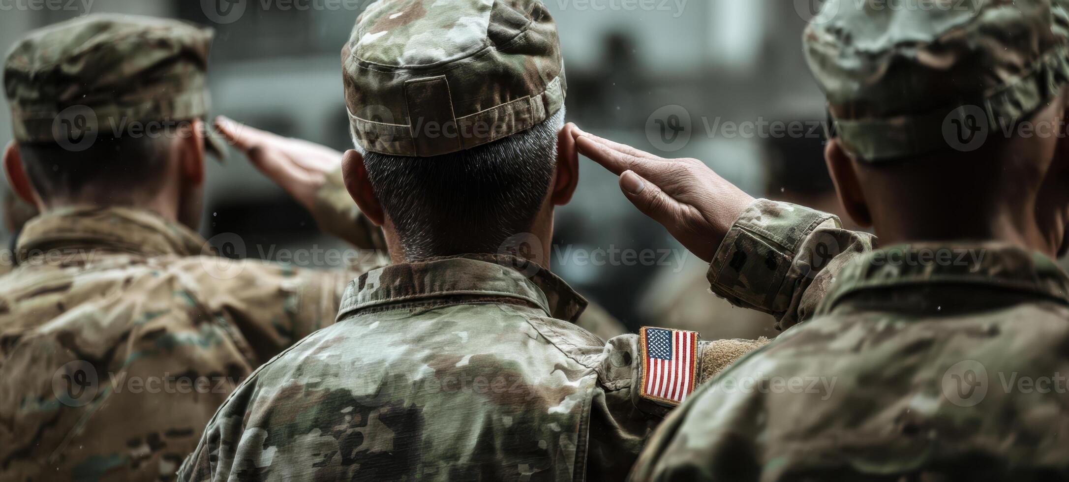 The soldiers salute in honor of their commitment and dedication to service. photo