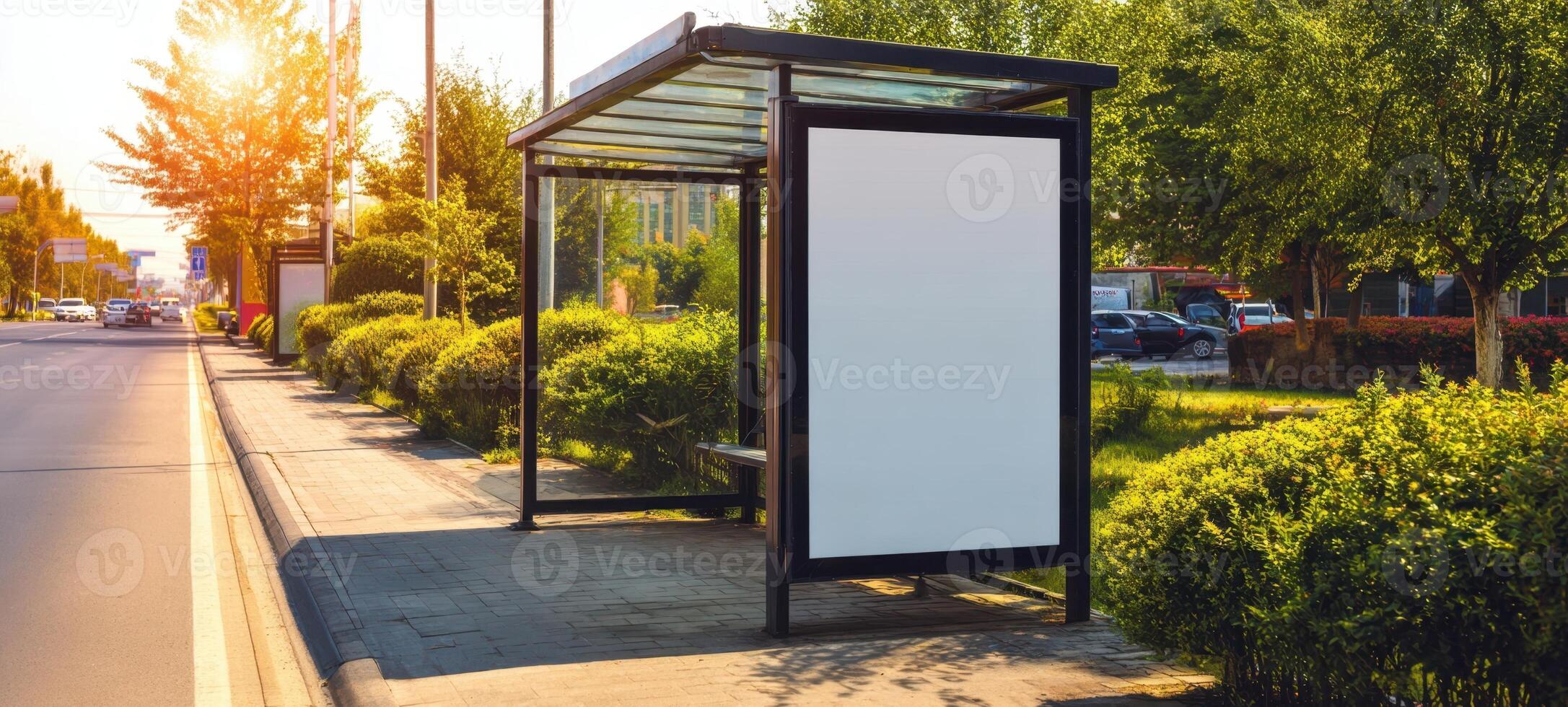 The empty bus shelter under the warm sunlight in an urban setting. photo