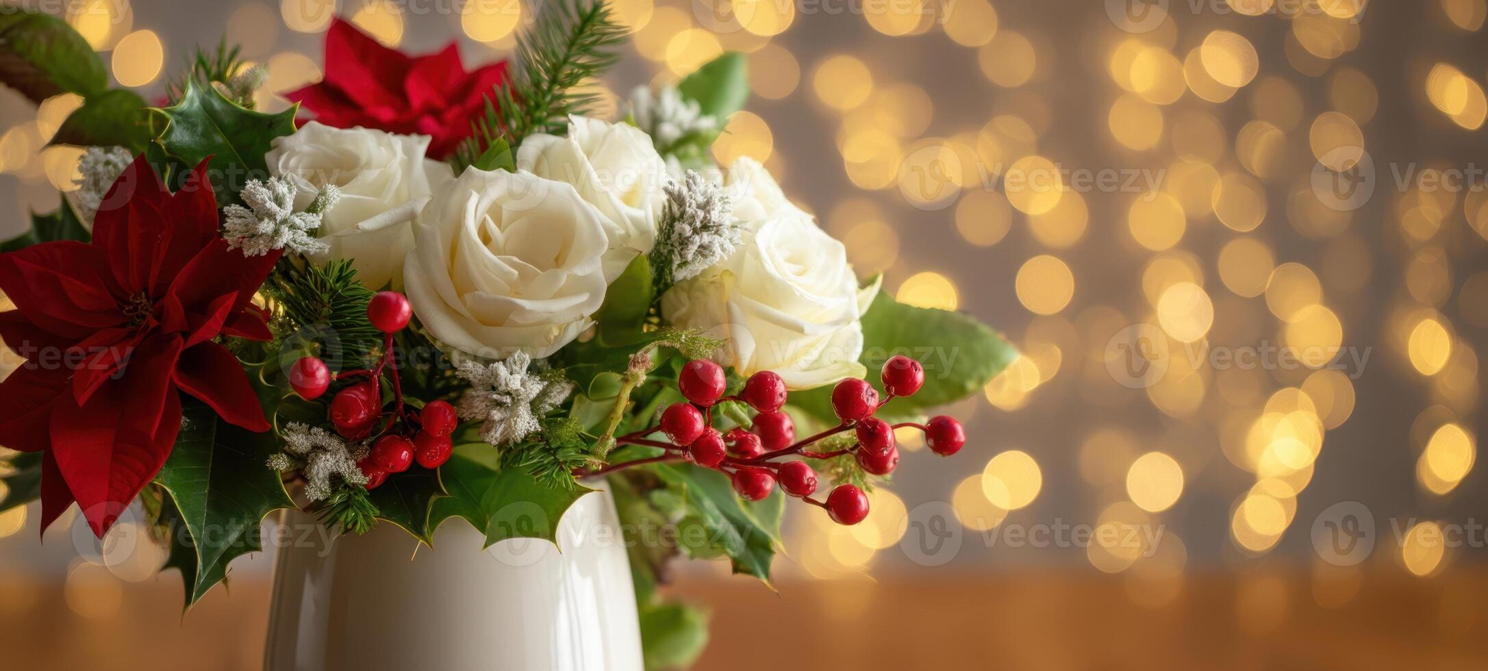 The beautiful holiday floral arrangement with roses and poinsettias shimmering softly. photo