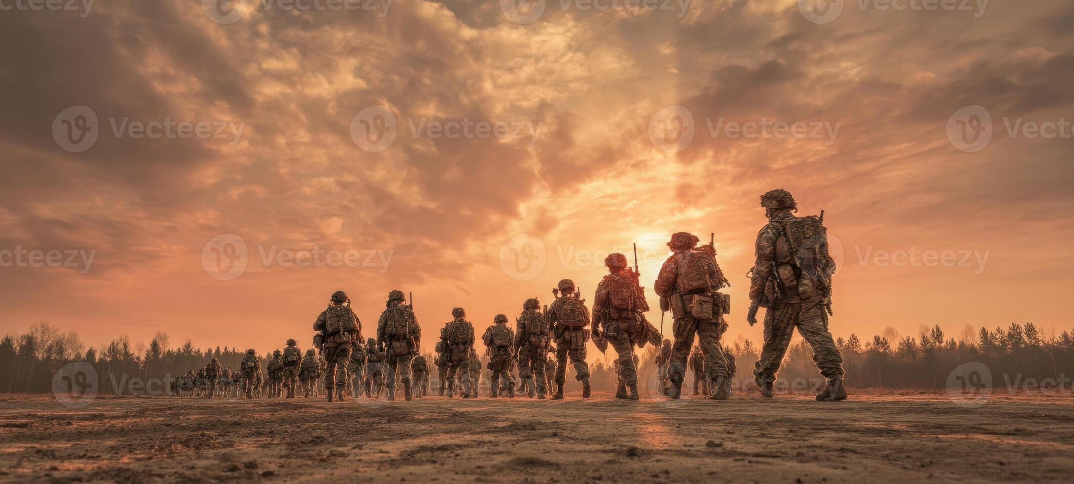 The soldiers marching towards the horizon under a dramatic sunset backdrop. photo