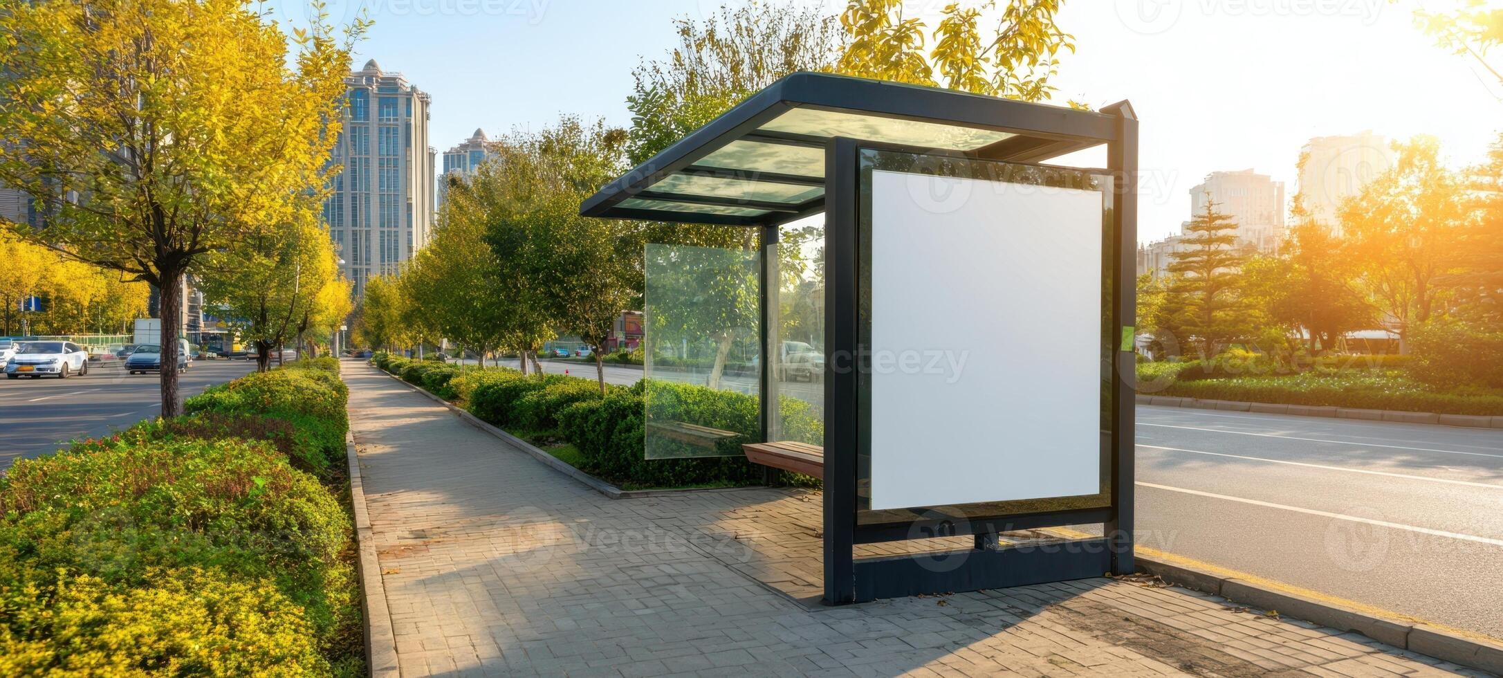 The empty bus stop surrounded by greenery and sunlight in a serene urban environment. photo