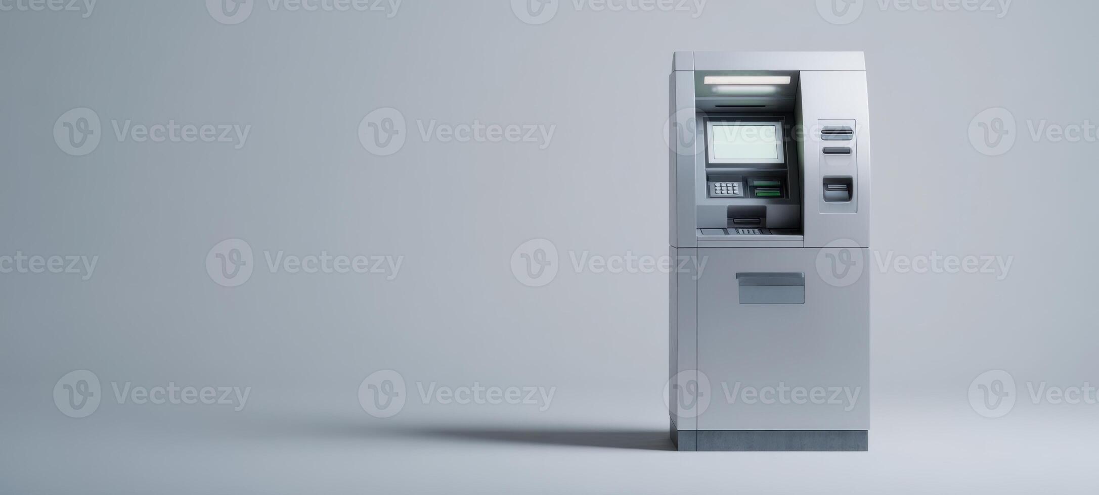 The modern ATM machine standing solitary in a minimalist environment. photo
