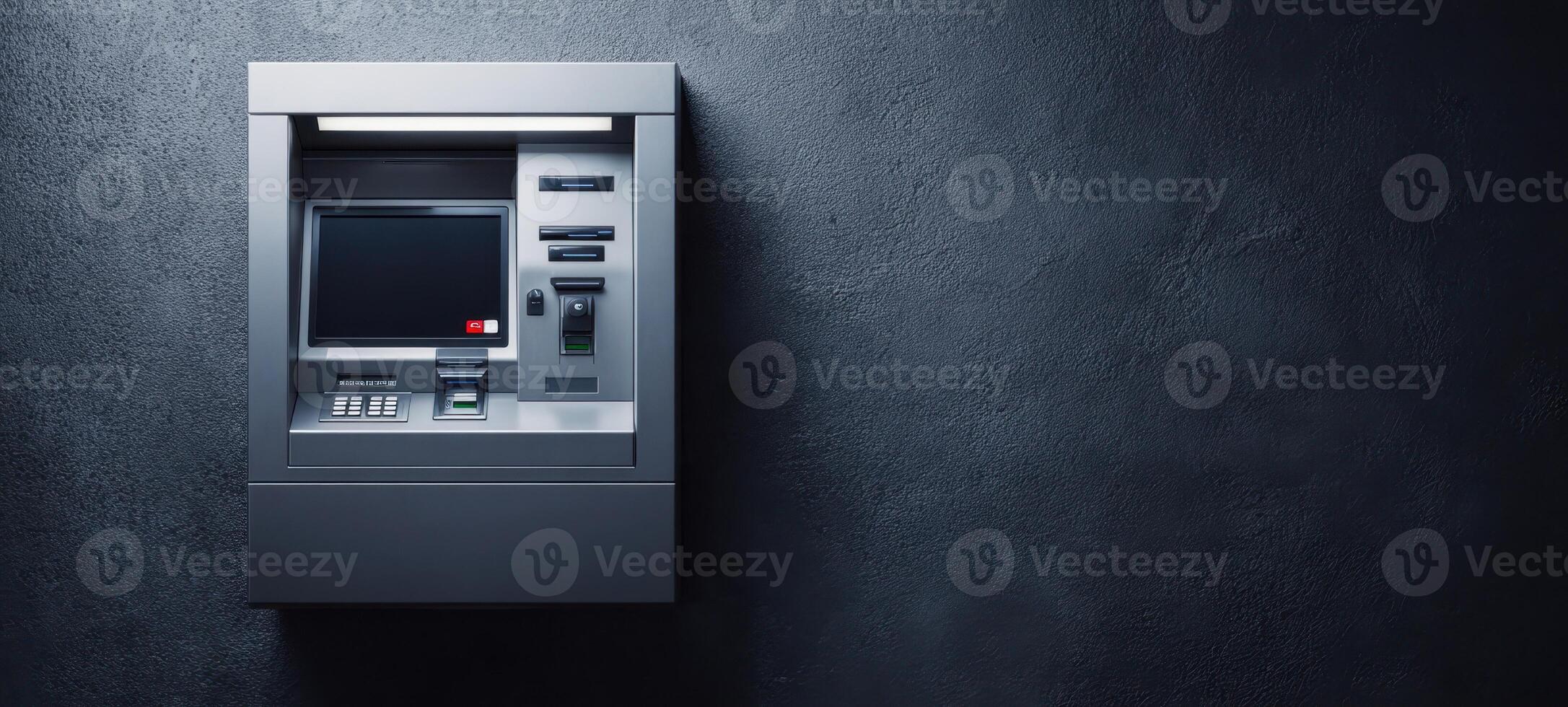 The ATM against a textured wall in a modern banking environment. photo