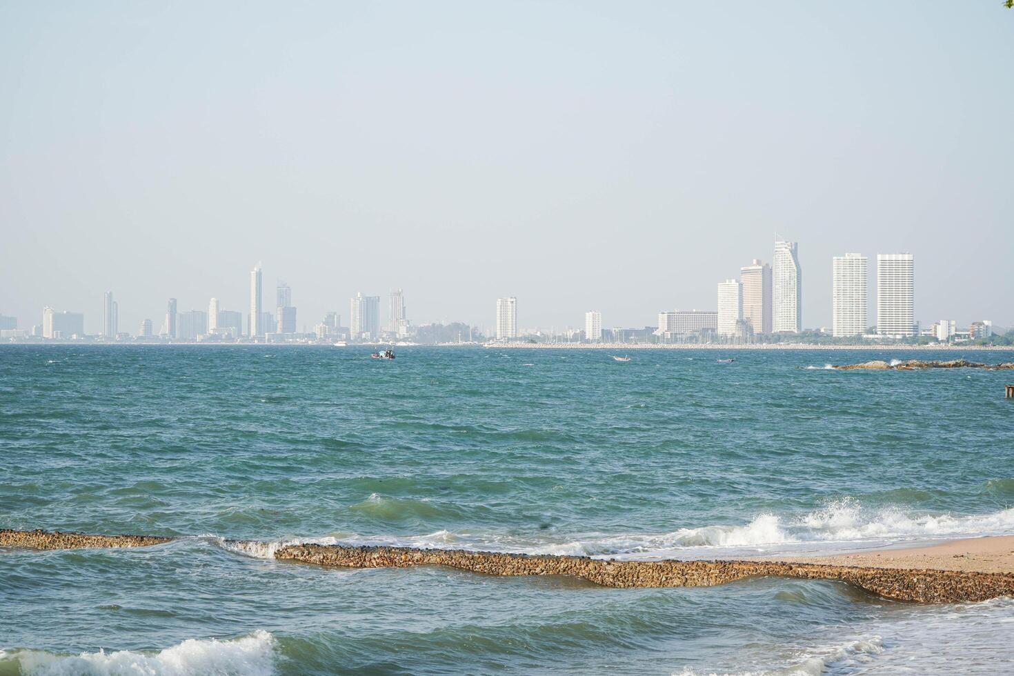 Clear sea water and blue sky overlooking the city photo