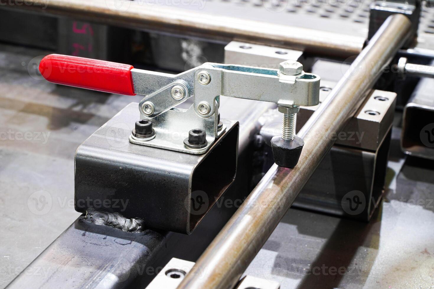 Toggle clamp for locking welding machine parts.For clamping workpieces and inspection JIGs photo