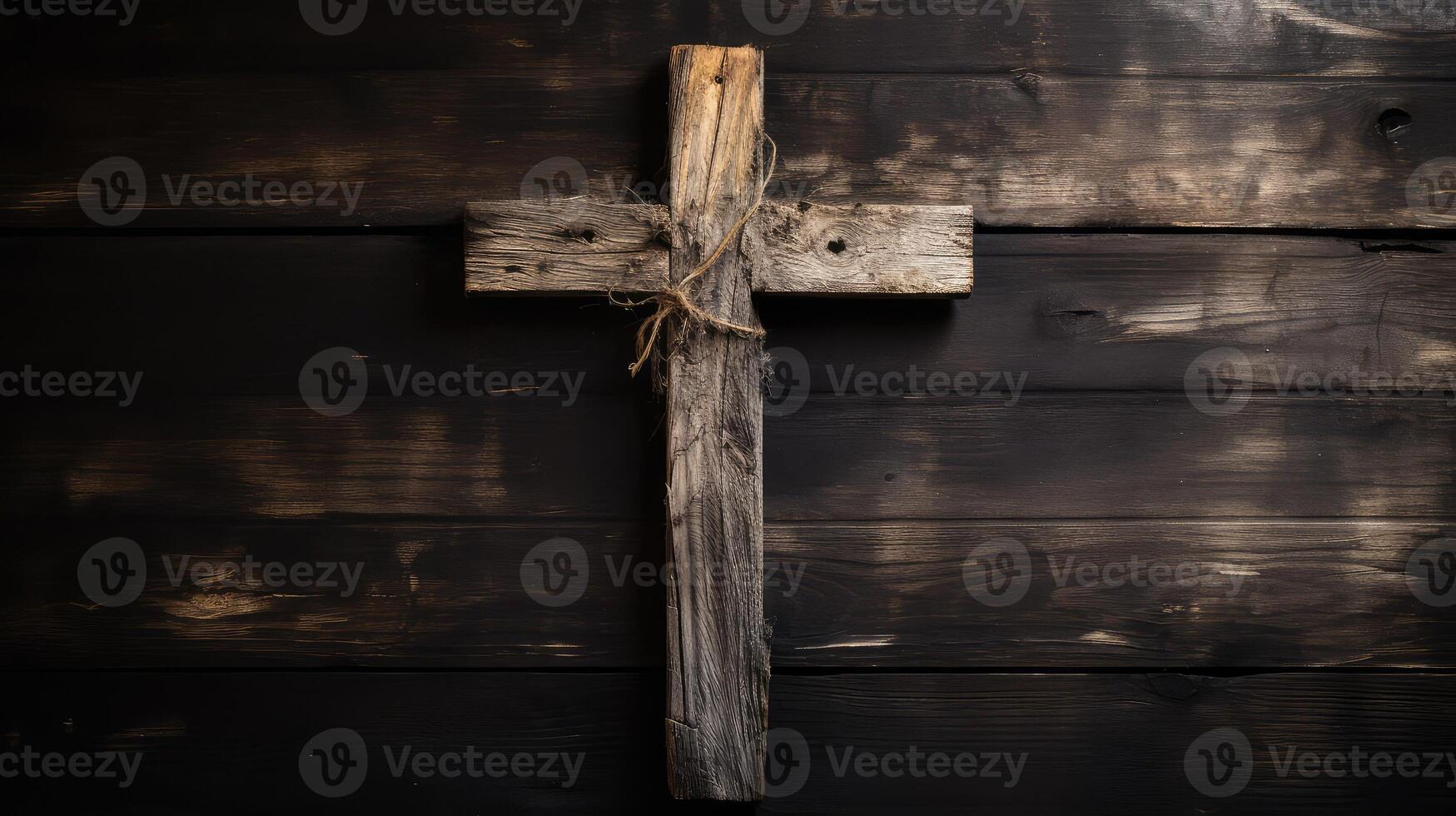 centered wooden cross on black photo