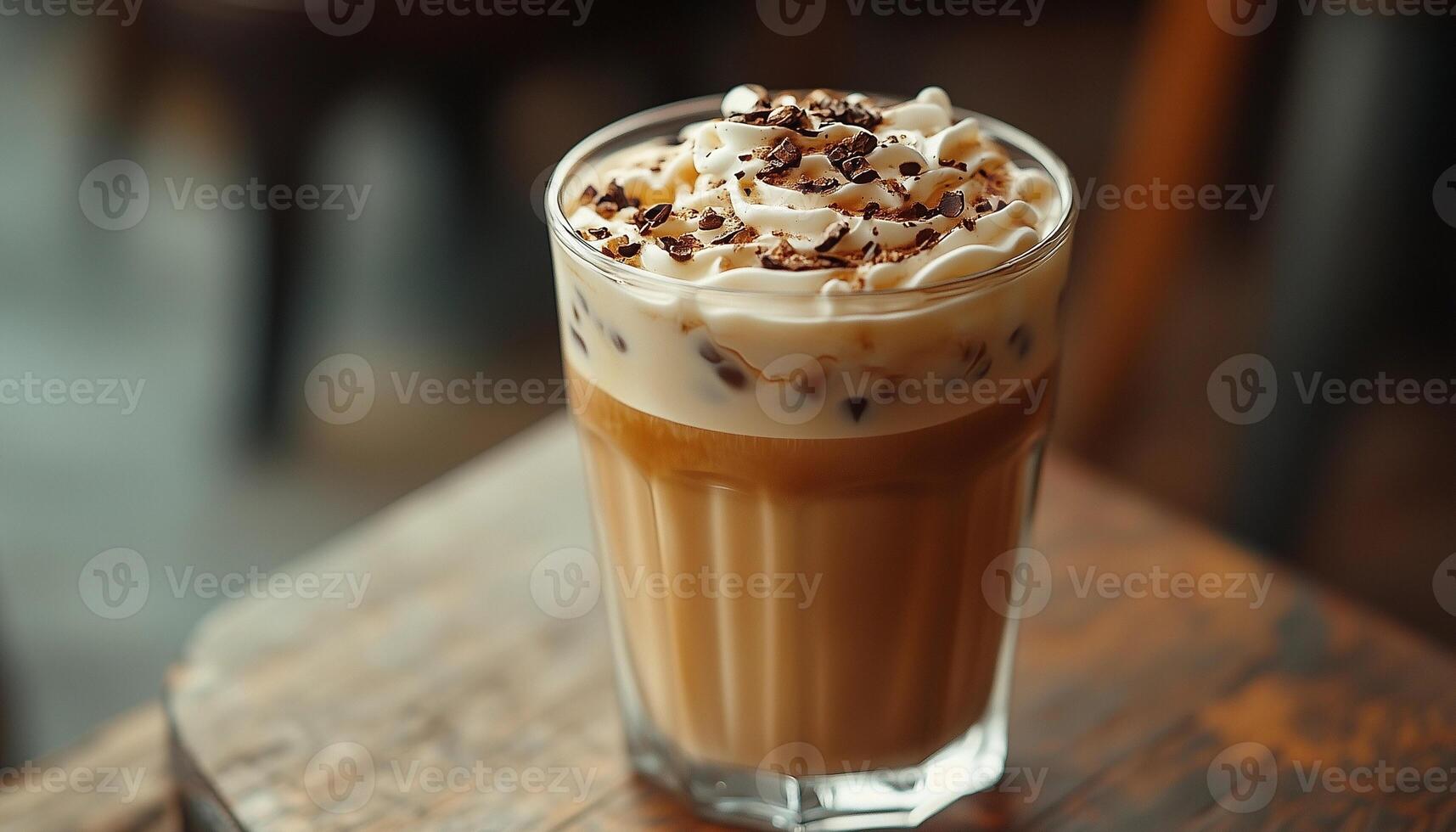 An iced coffee with whipped cream and chocolate chips photo
