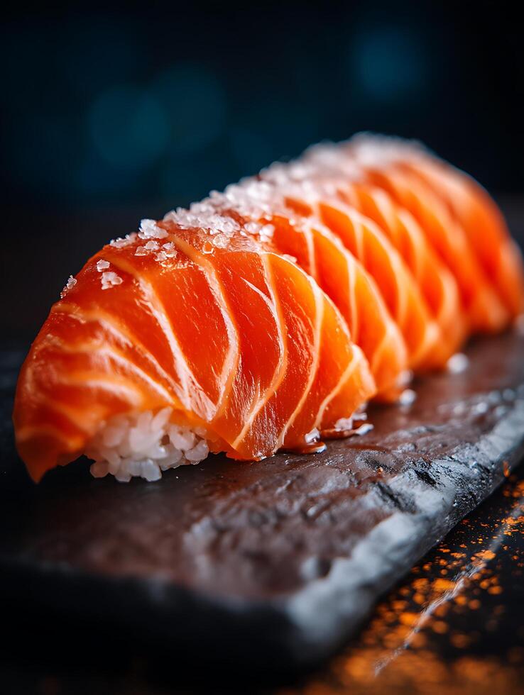 Close Up of Salmon Sashimi on a Dark Stone Plate. A Delicious Image of Fresh, Raw Fish. photo