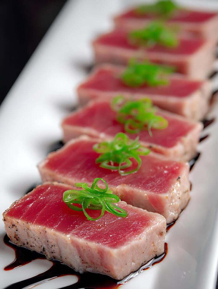 Seared Tuna Steaks with Green Onions and Balsamic Glaze Close Up of Gourmet Appetizer. photo