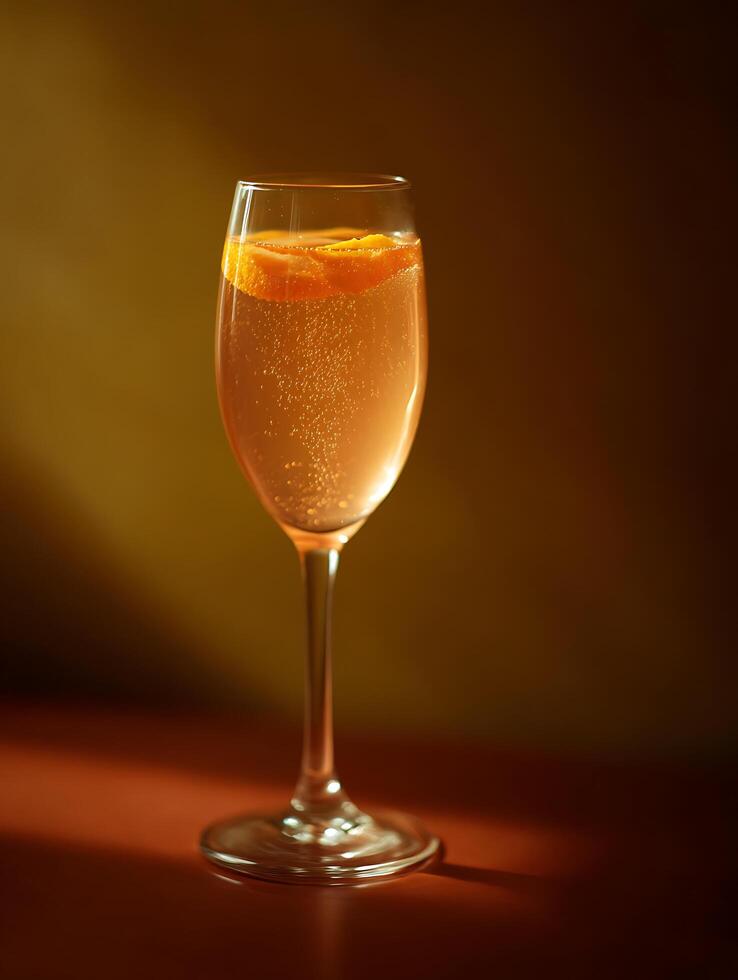 Sparkling Aperitif Cocktail in a Champagne Flute Glass. A close up image showcasing a refreshing drink with an orange twist. photo
