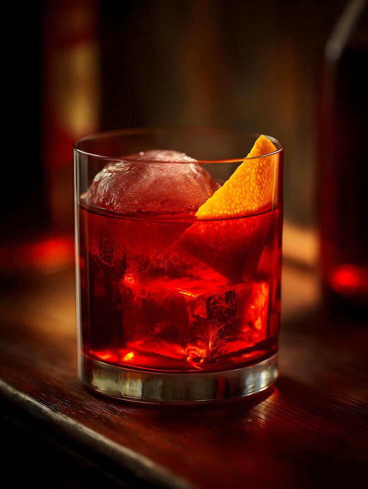 Negroni Cocktail with Ice and Orange Garnish in a Rocks Glass. A close up image perfect for beverage menus or bar websites. photo