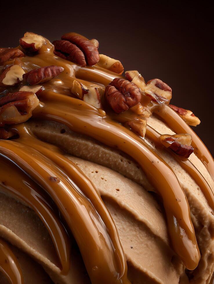 Close up of Caramel Sauce Drizzled Over Creamy Ice Cream with Pecan Pieces. photo