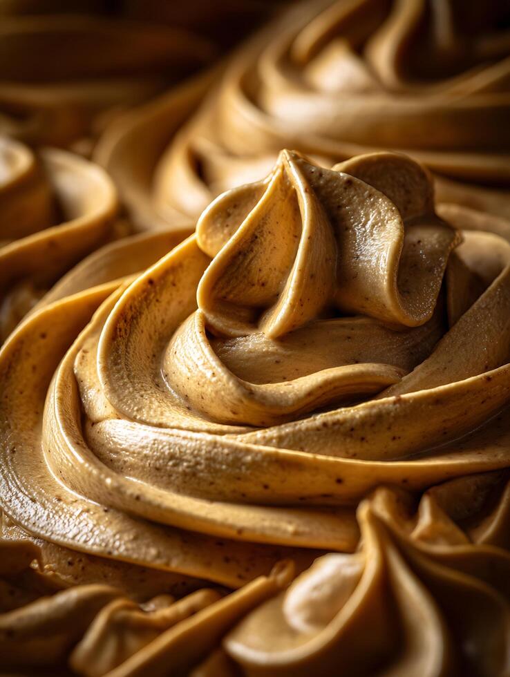Close Up of Creamy Brown Buttercream Frosting Swirls. A delectable image perfect for food blogs, recipe websites, or bakery marketing. photo