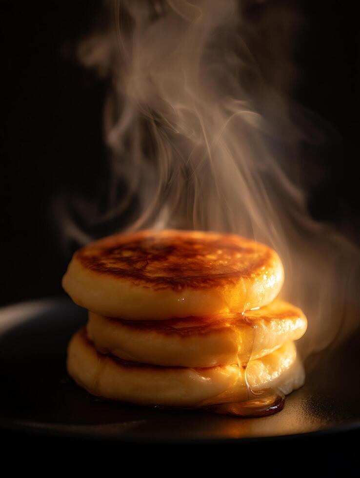 Stack of Golden Pancakes with Drizzling Syrup and Steam. A mouthwatering close up of freshly made pancakes. photo