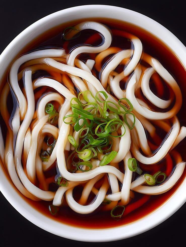 Close up of Udon Noodles in Broth, Japanese Cuisine. photo