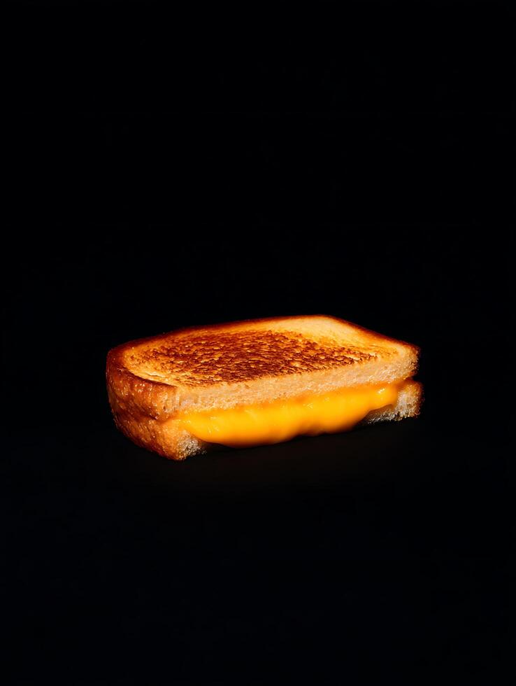 A Delicious Grilled Cheese Sandwich Close Up on Black Background. photo