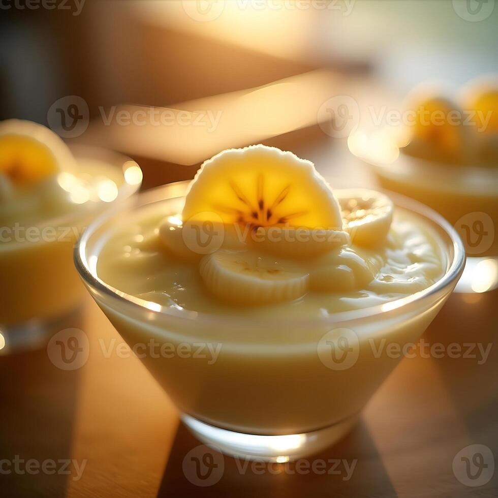 Serving of Banana Pudding in Glass Bowl with Sliced Fruit Topping photo