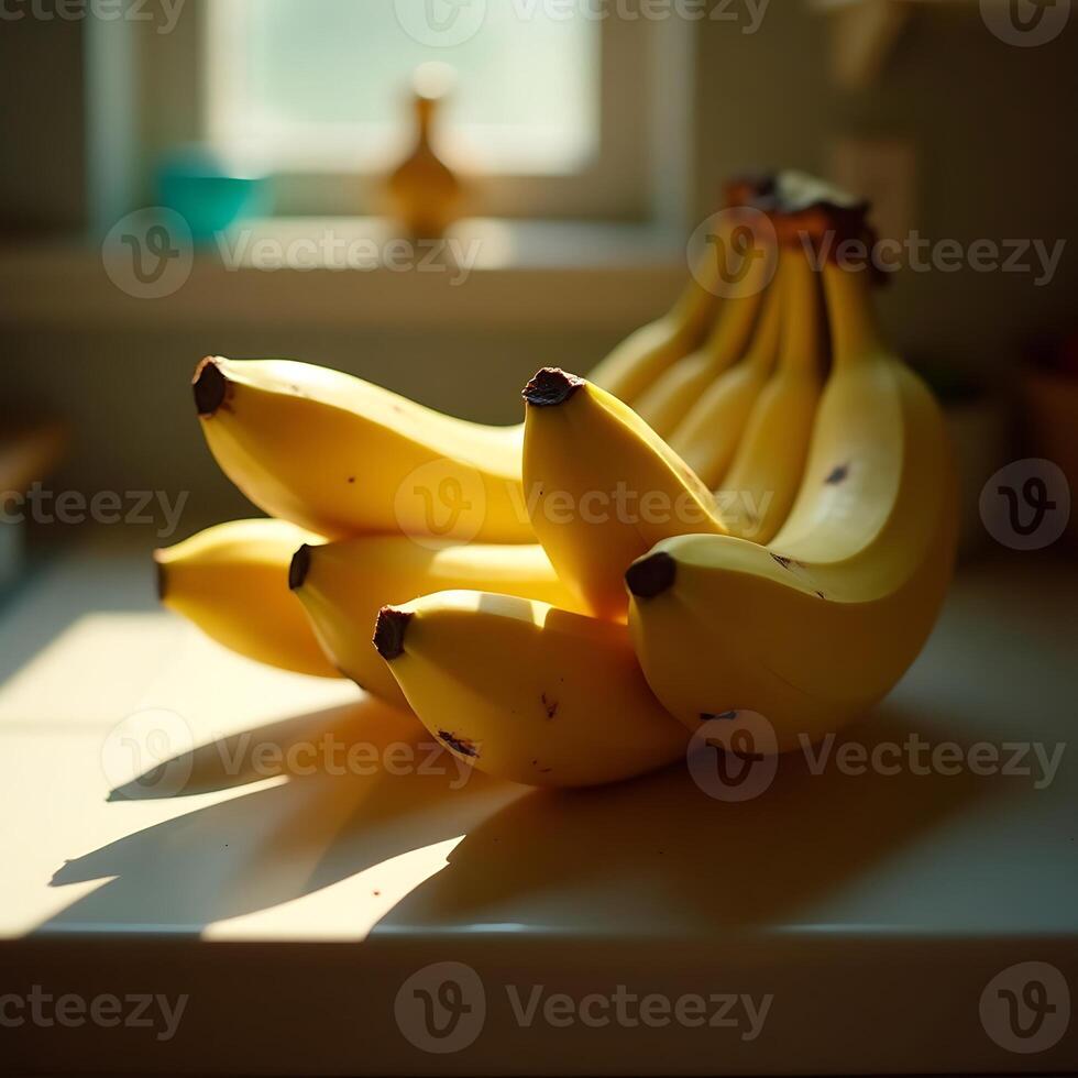 Bananas on a Countertop in Morning Sunlight Ready to Eat photo