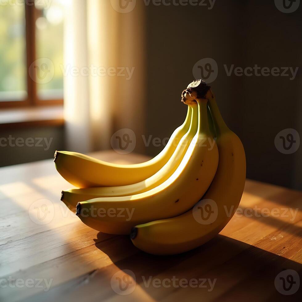 Bunch of Ripe Bananas on Wooden Table in Sunlight photo