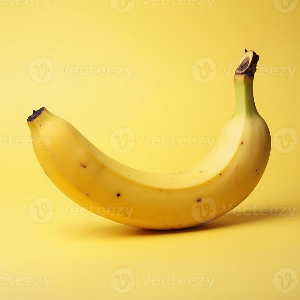 Single Banana Fruit on Yellow Background Still Life photo