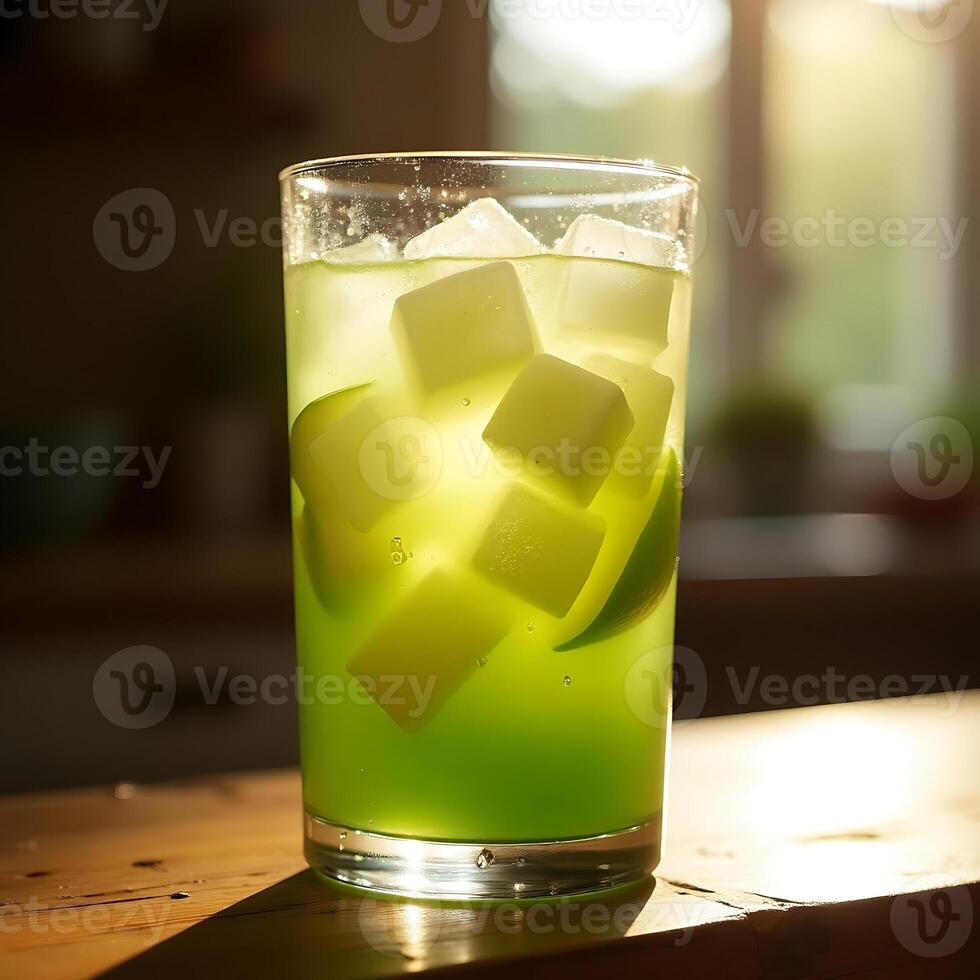 Refreshing Green Drink with Ice Cubes and Lime on Wooden Surface photo