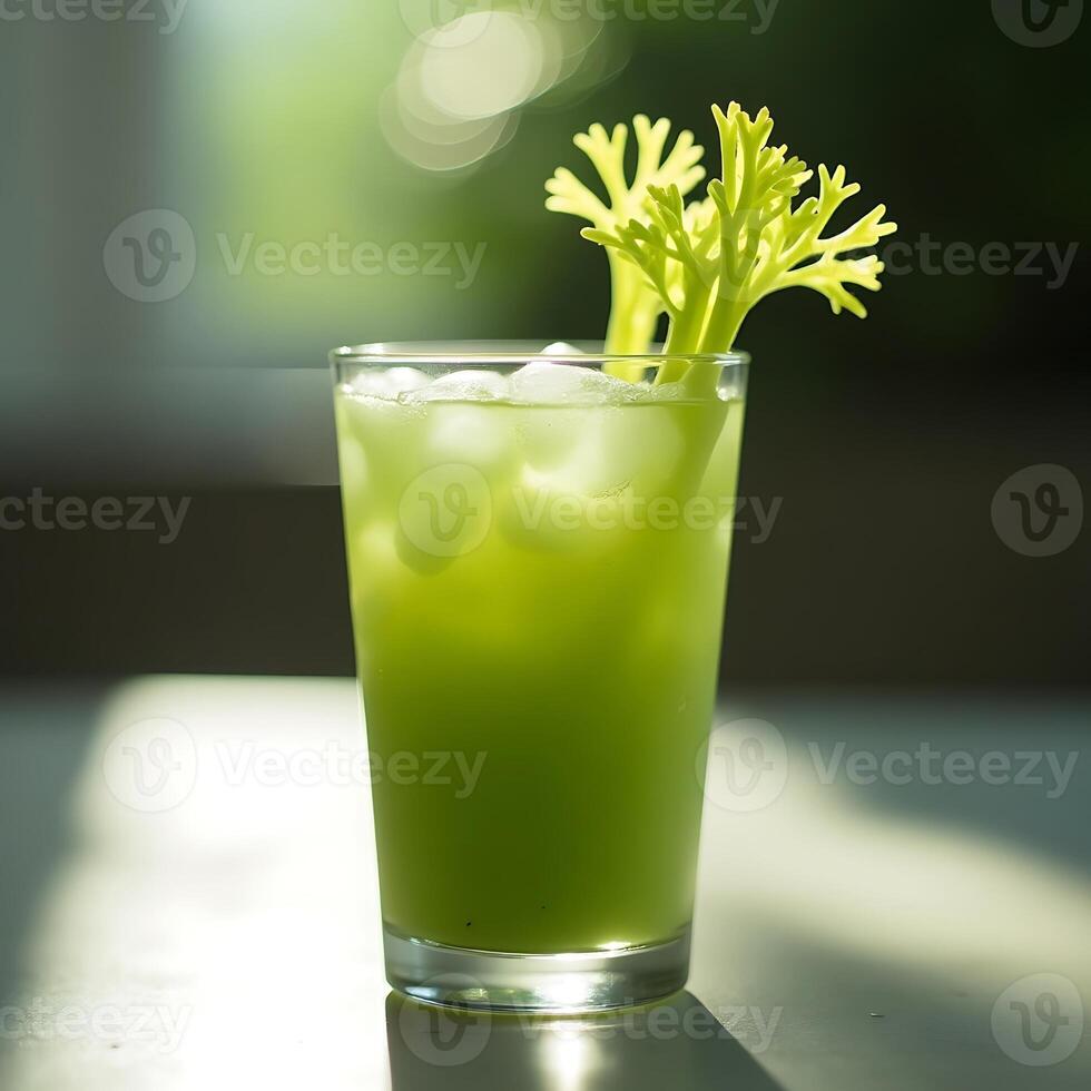 Celery Juice with Ice in Glass Refreshing Green Drink photo