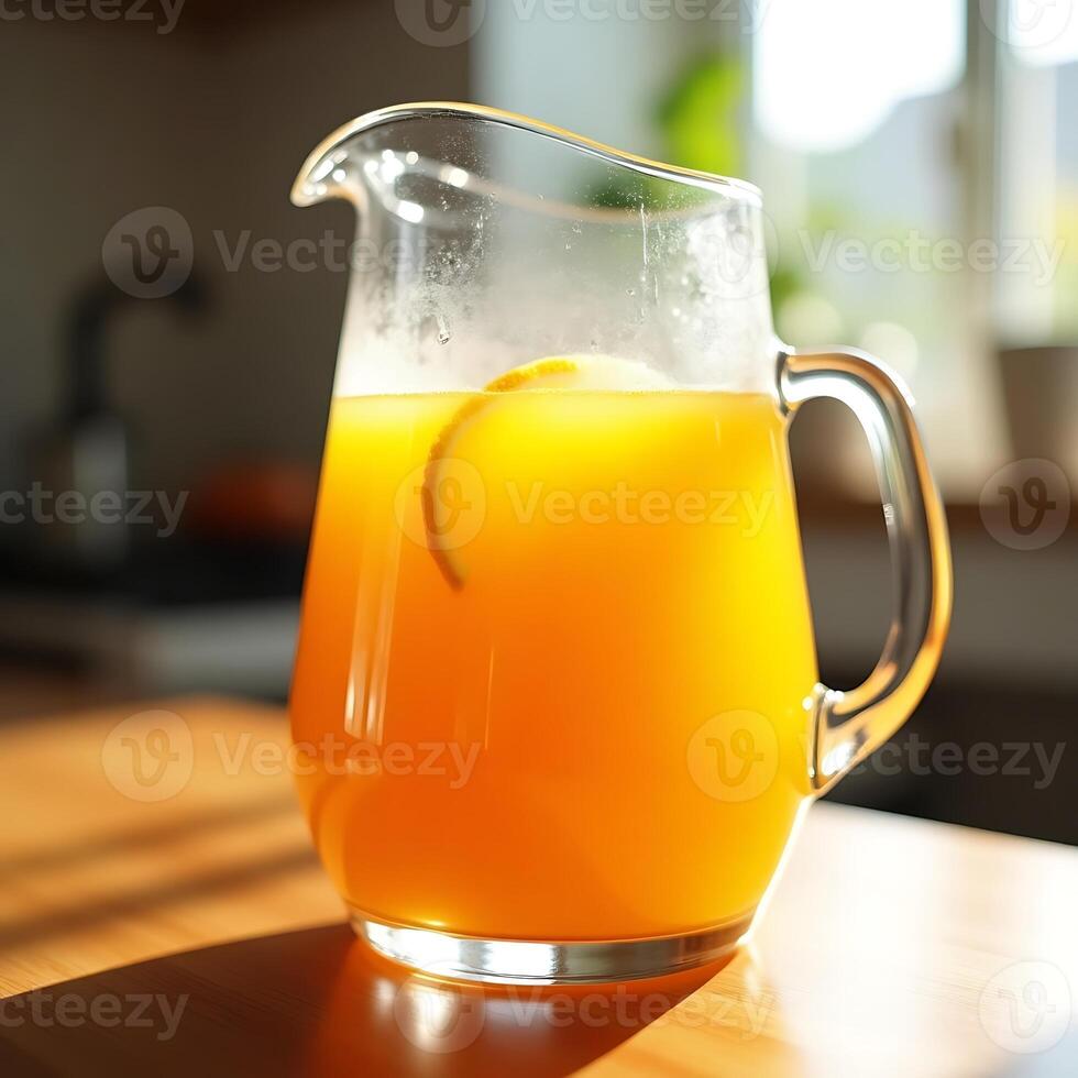 Pouring Refreshing Orange Juice in Glass Pitcher with Citrus Slice photo