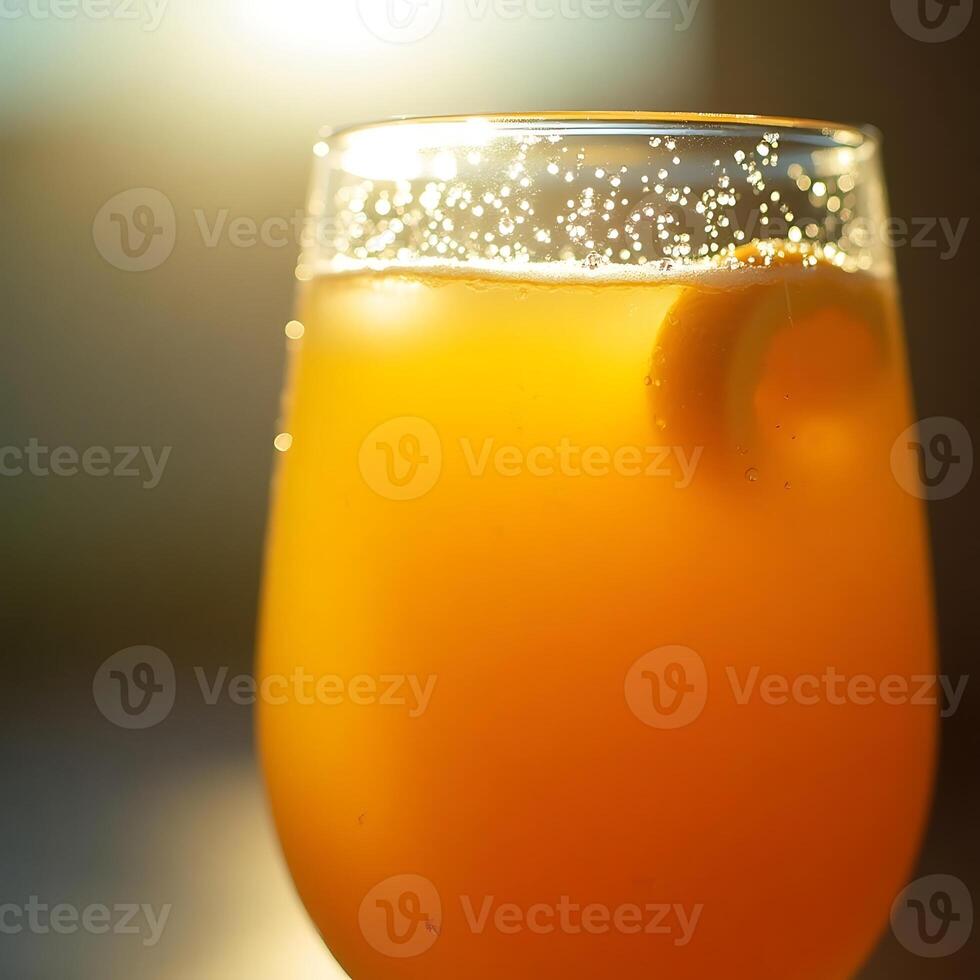Refreshing Orange Drink with Bubbles and Slice in Glass photo
