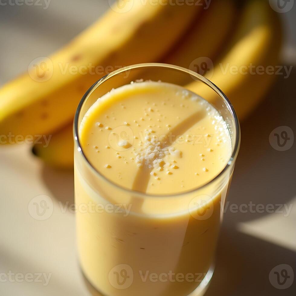 Banana Smoothie in Glass with Bananas Fresh Blended Drink photo