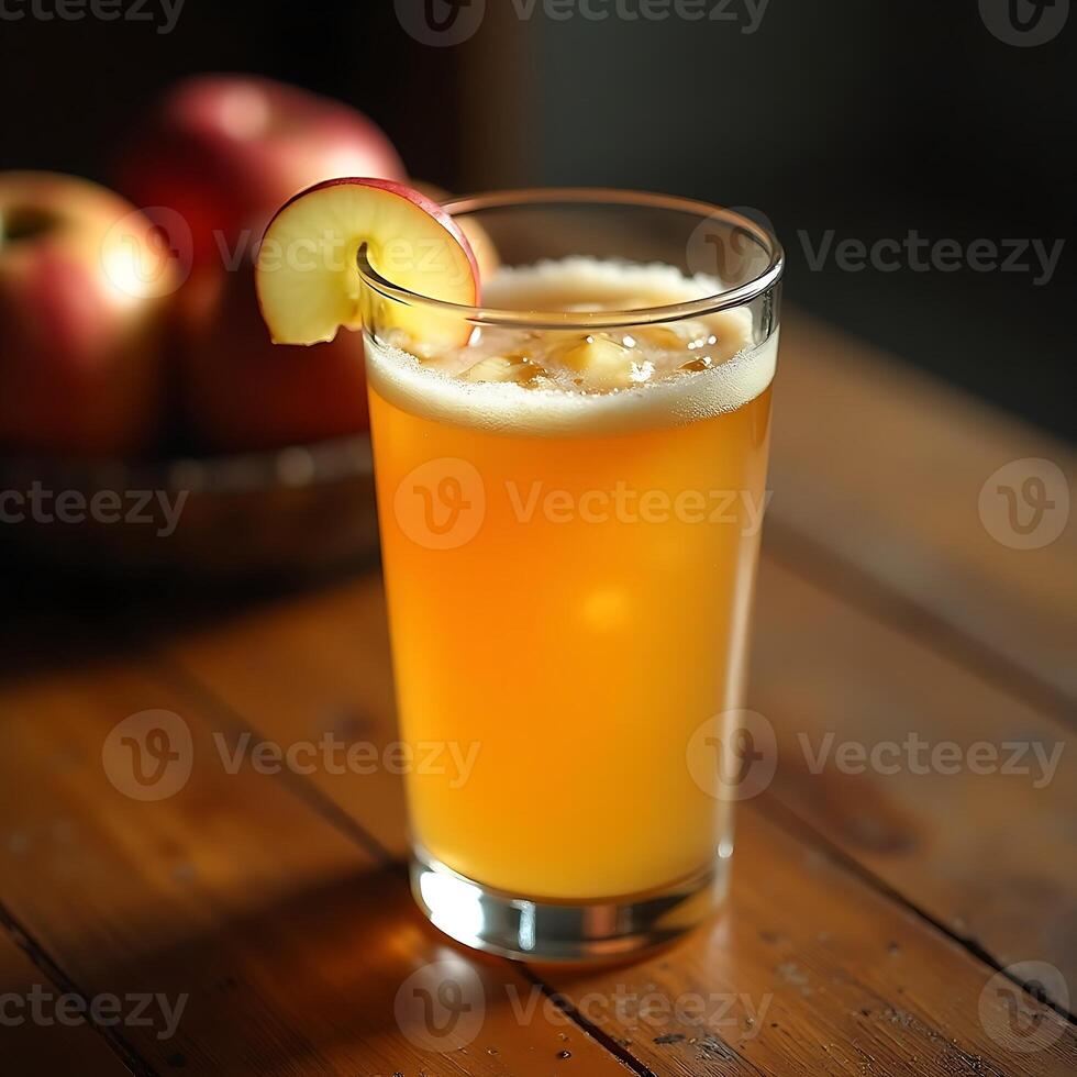 Serving of Apple Cider Drink with Apple Slice on a Wooden Table photo