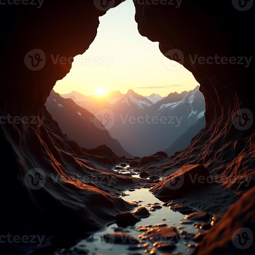 Cave View of Mountains and Sunset with Water Stream photo