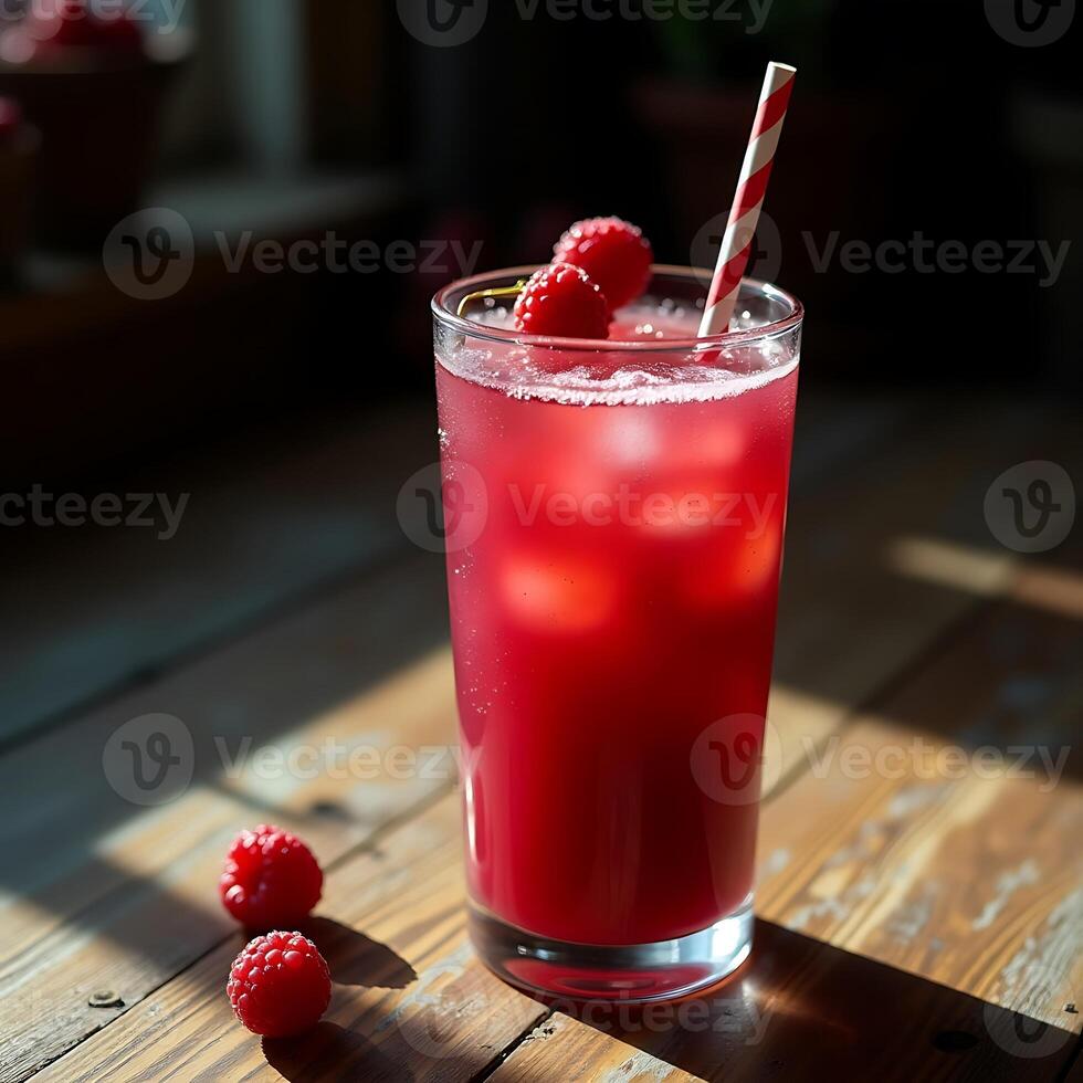 Refreshing Raspberry Drink with Ice and Striped Straw on Wooden Table photo