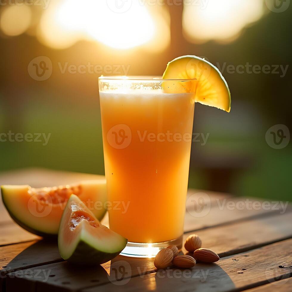 Refreshing Melon Juice in Glass with Almonds on Wooden Table photo