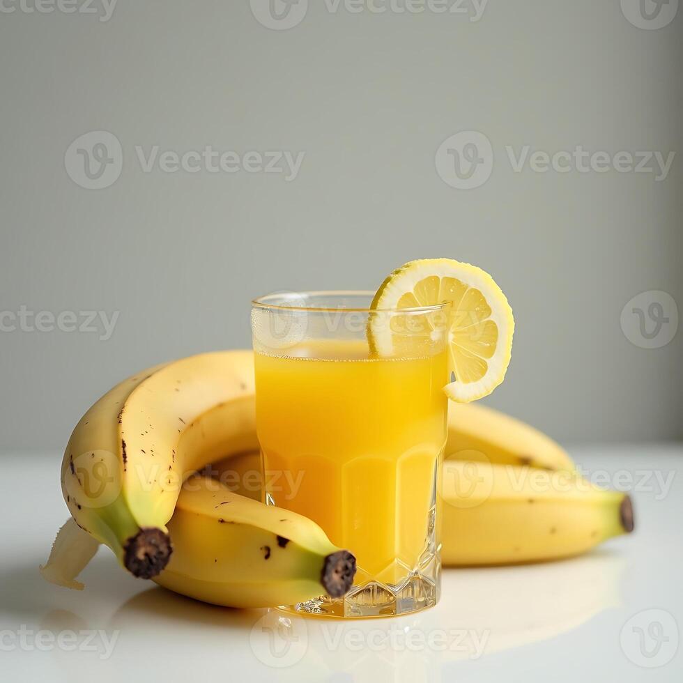 Preparing Banana Juice with Lemon in Glass photo