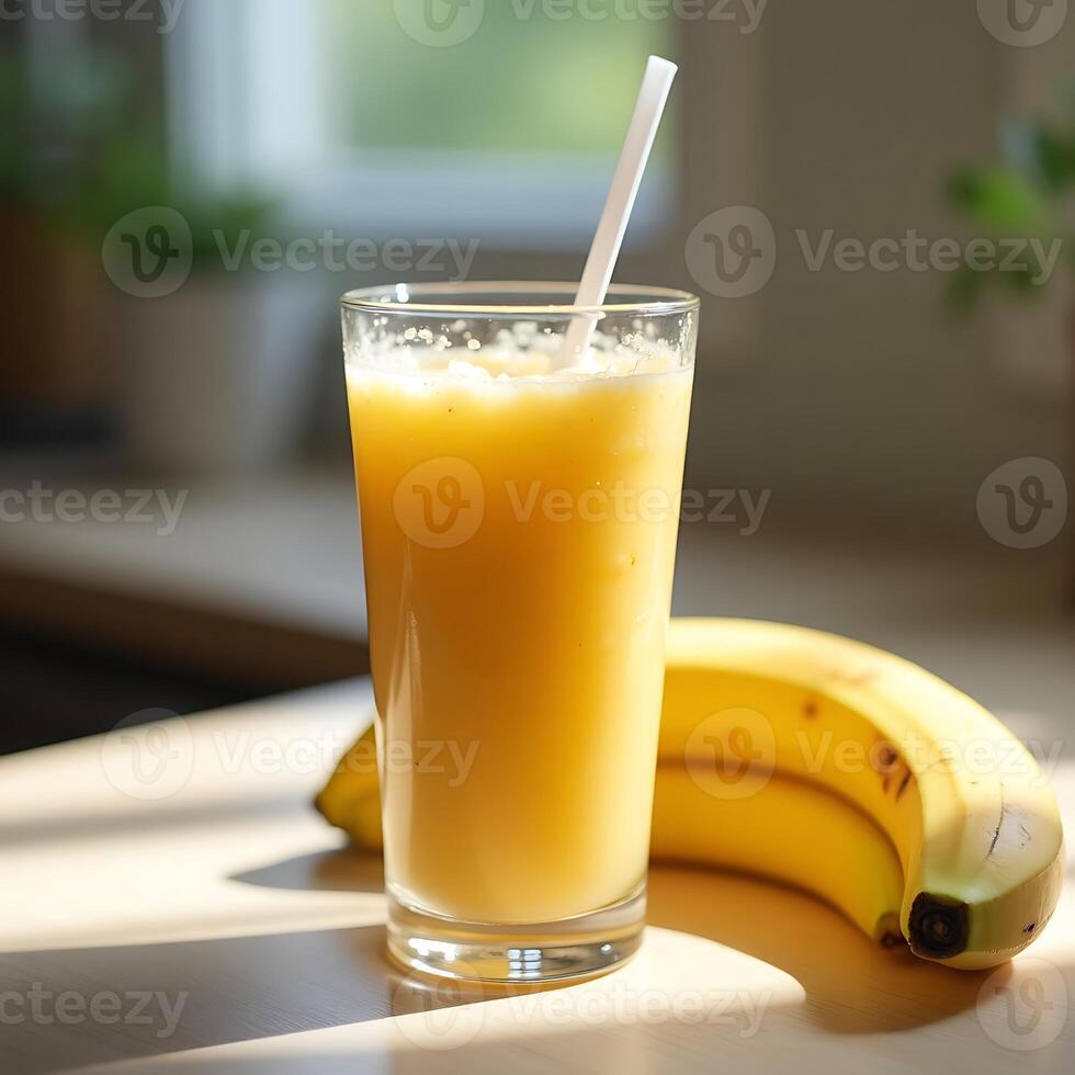 Drinking Banana Smoothie in Glass with Straw and Ripe Fruit photo