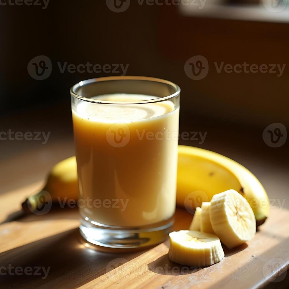 Banana Smoothie in Glass with Sliced Fruit on Wooden Board photo