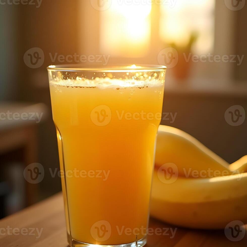 Pouring Yellow Drink with Fruit Near Sunny Window photo