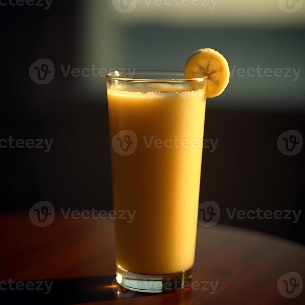 Banana Smoothie in Glass with Slice Garnish on Dark Table photo