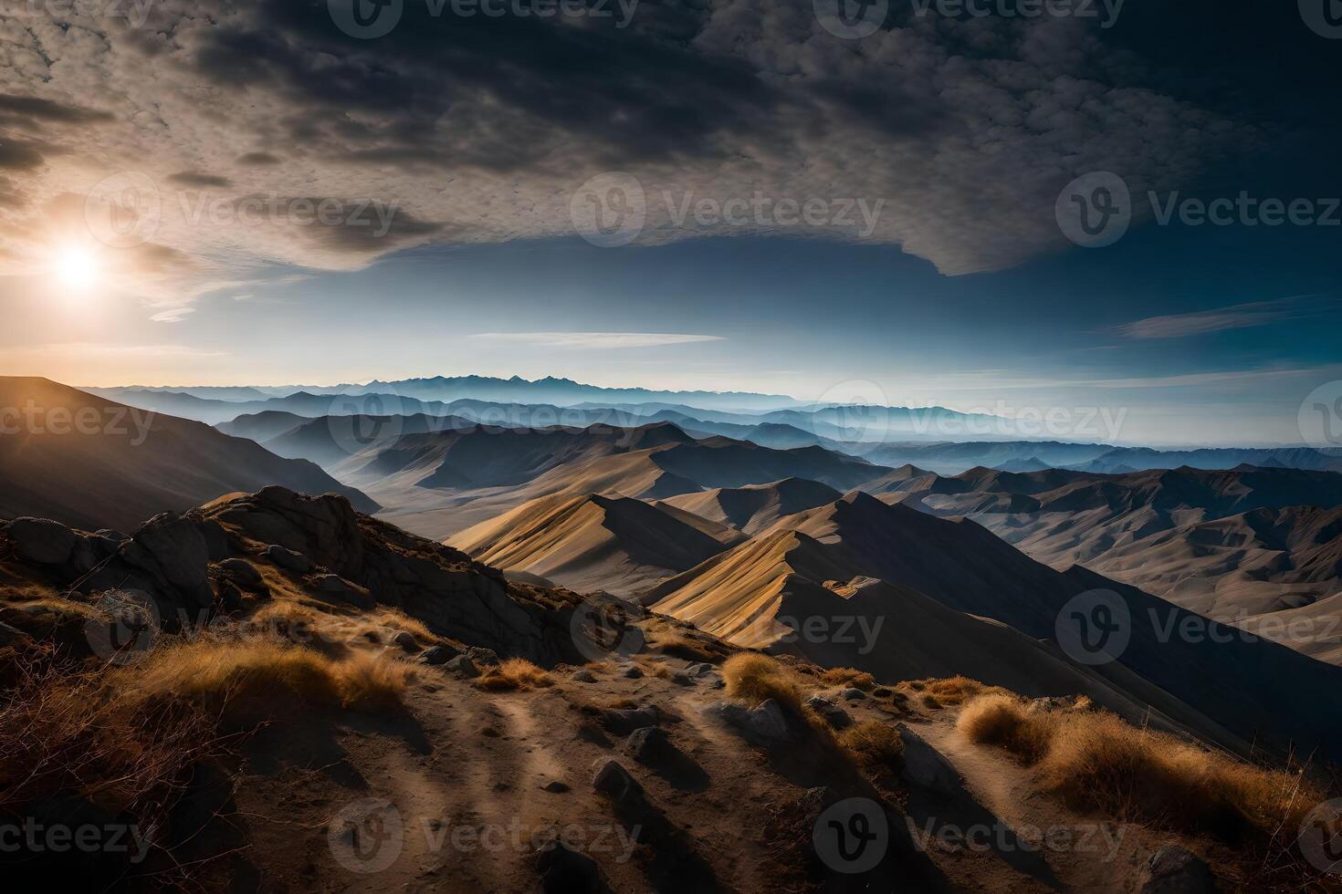 The sun shines over the mountains in this photo