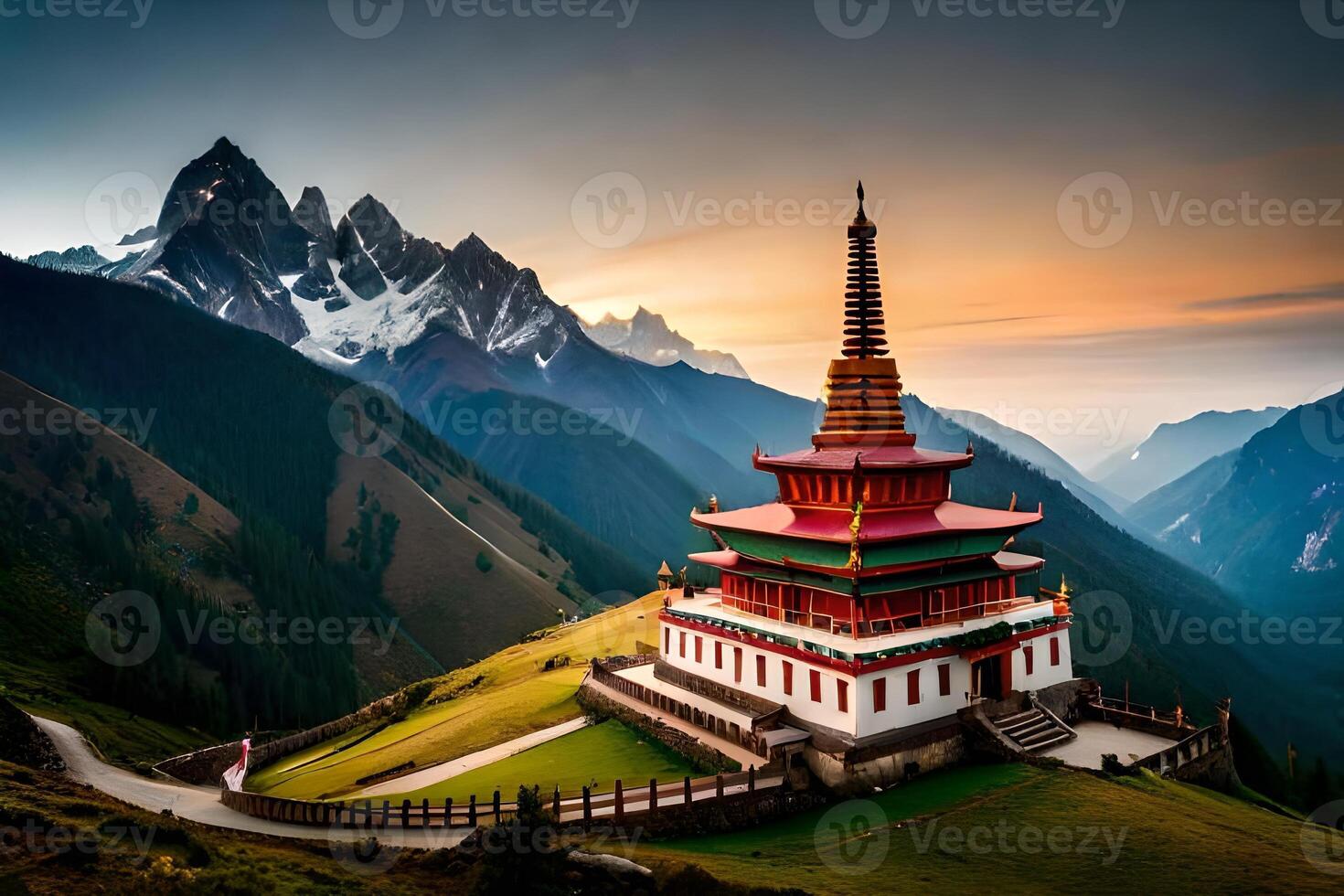A pagoda sits on top of a mountain at sunset photo