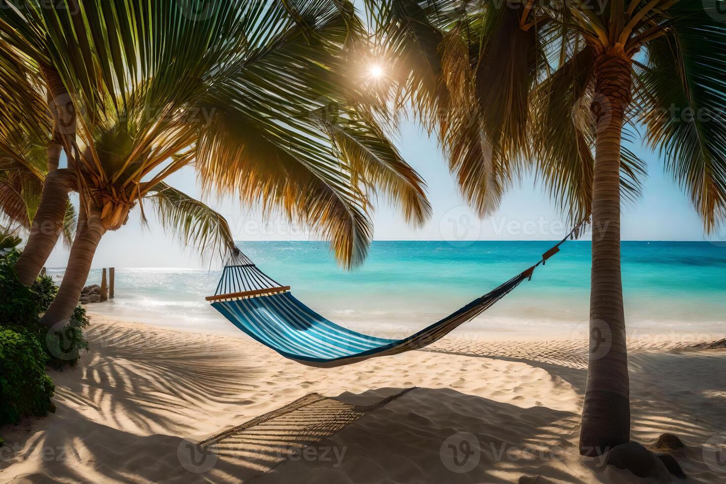 Hammock on the beach with palm trees photo