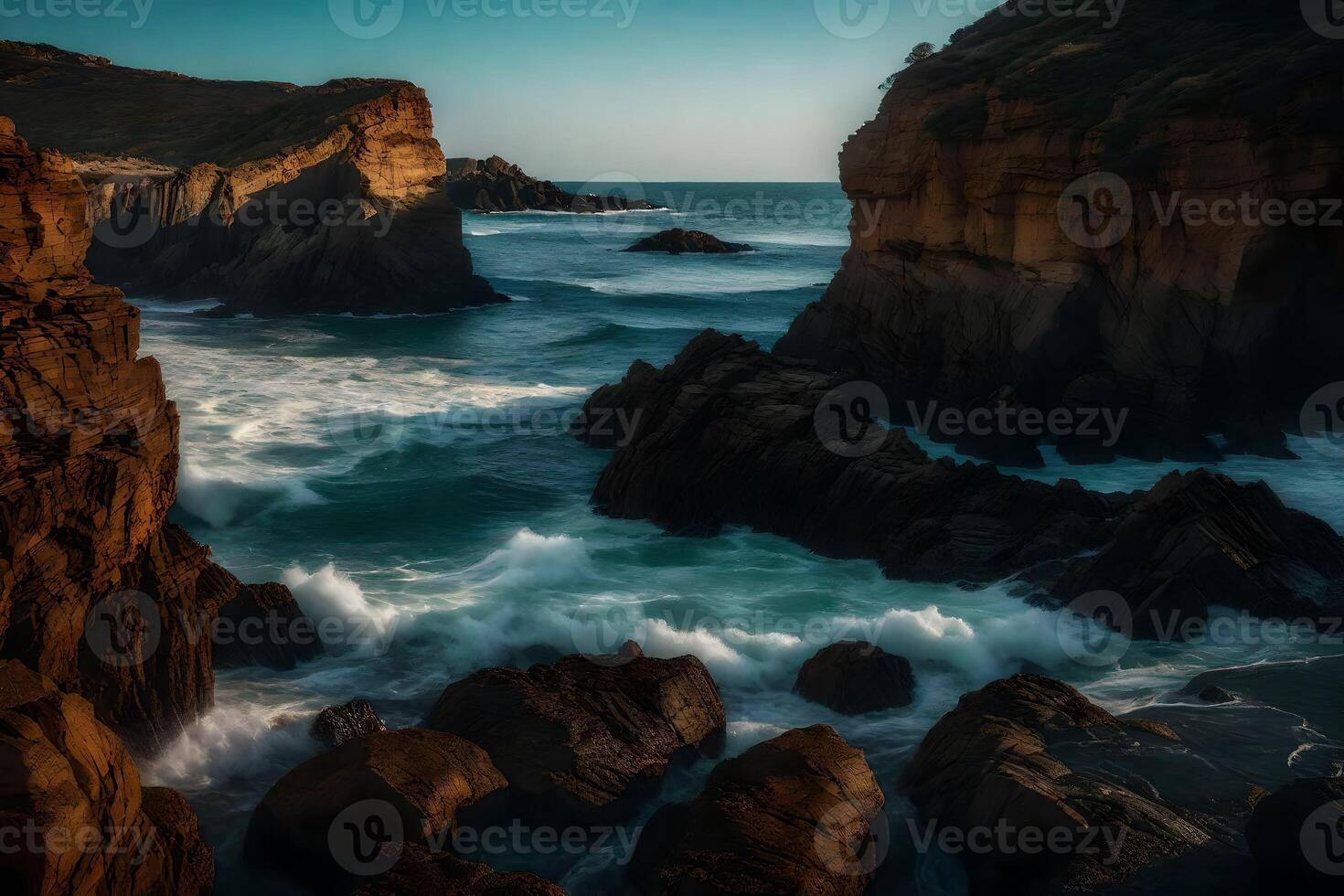 A rocky coastline with waves crashing against the rocks photo
